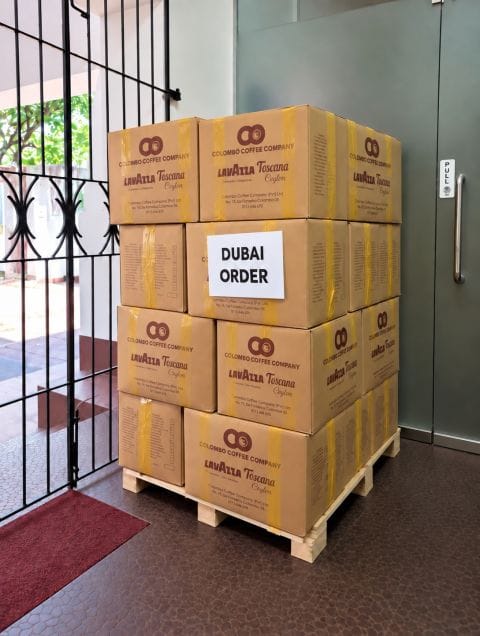 Stacked boxes of Sri Lankan green coffee packed and ready for export to Dubai